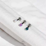 piercings em aço com opalas